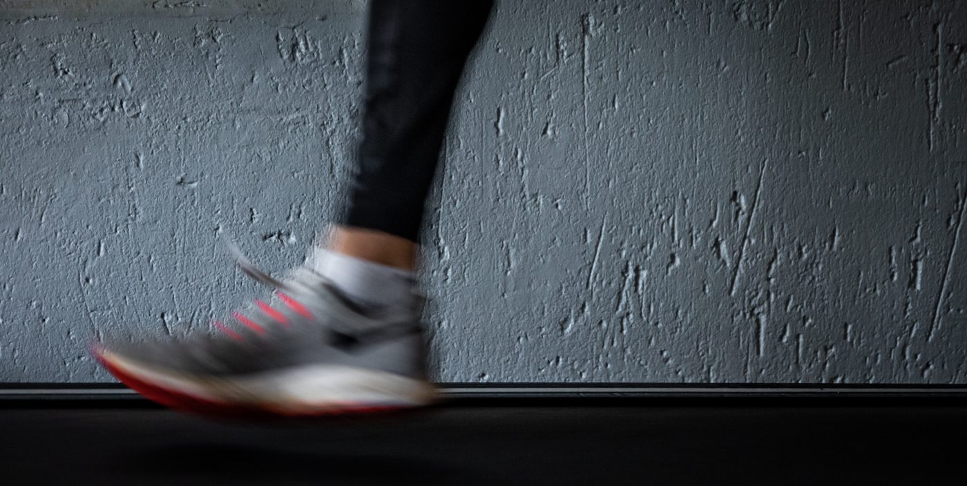 person running on treadmill